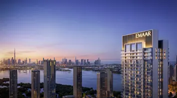 Dubai Creek Harbour: a residential tower at dusk, the Creek and the city skyline behind