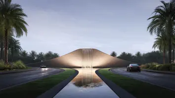 Grand Polo Club & Resort: the entrance road around a water feature, lined with palms