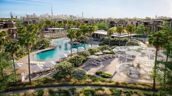 Nad Al Sheba Gardens: a lagoon pool among gardens and low-rise homes, the skyline in the distance